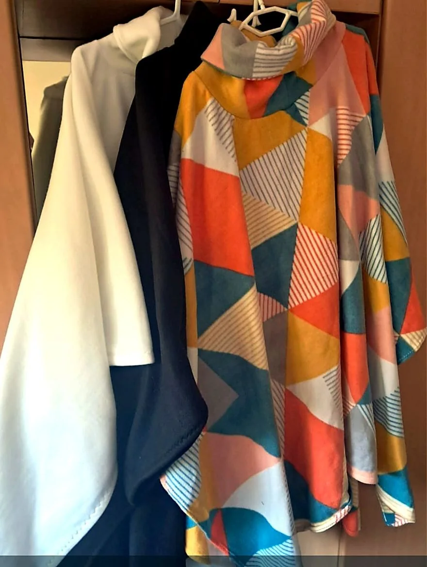 A colourful collection of handmade SandiBear fleece ponchos